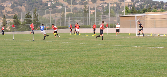 The mens soccer team works on their shooting.